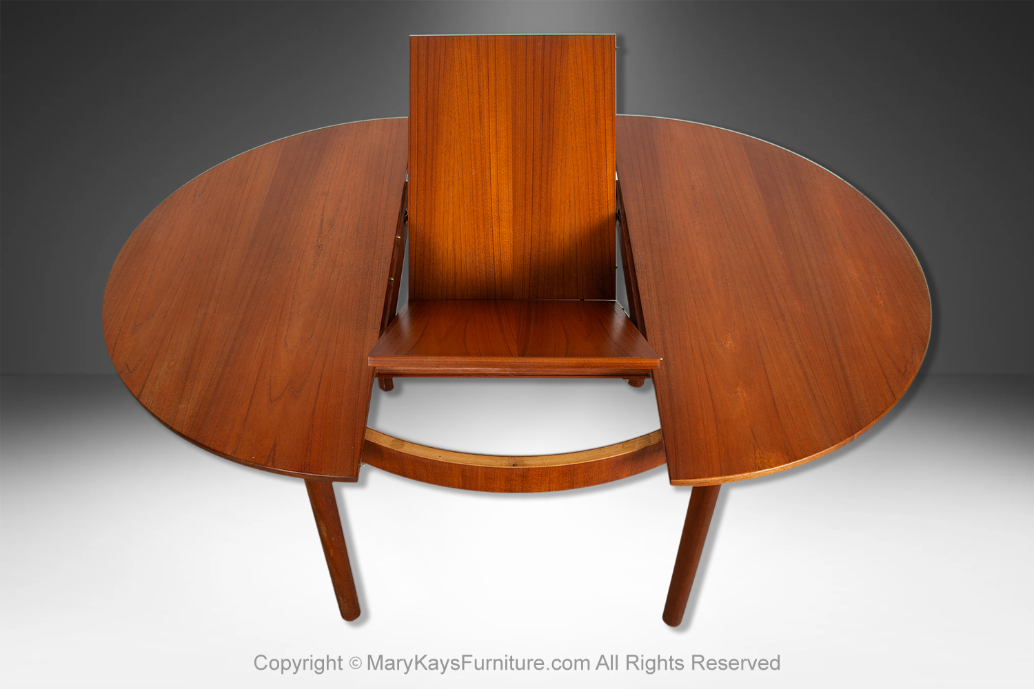 1b595941-b6fc-4c0e-bac9-24dc1c4e3203_Mid-Century-teak-Oval-Extendable-Dining-Table-by-McIntosh-of-Kirkcaldy-6.jpg